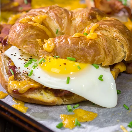 Bacon Wrapped Croissant Breakfast Sandwich